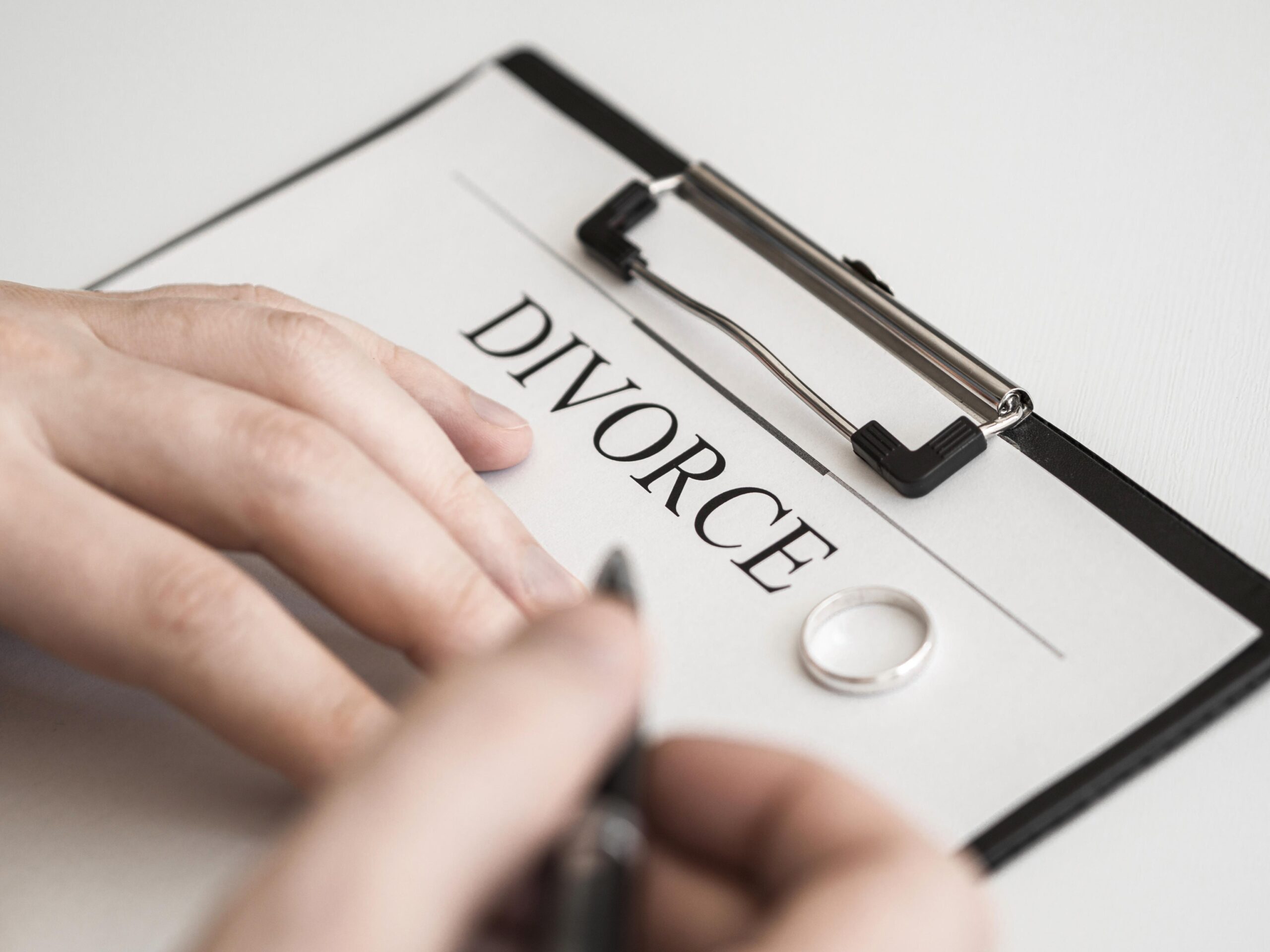 close-up-male-signing-divorce-contract